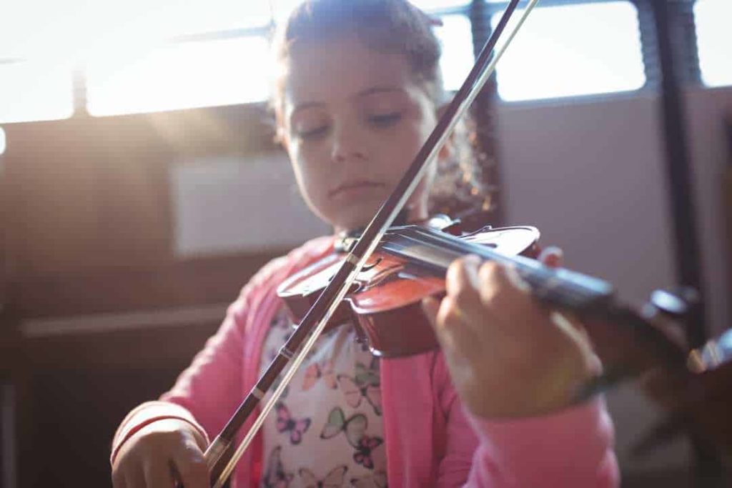 How it Works - young girl playing the violin